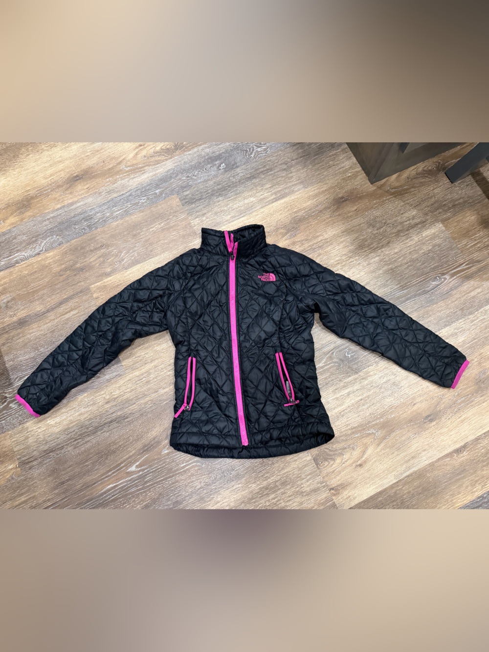 The North Face Kids Black Quilted Jacket with Pink Zippers